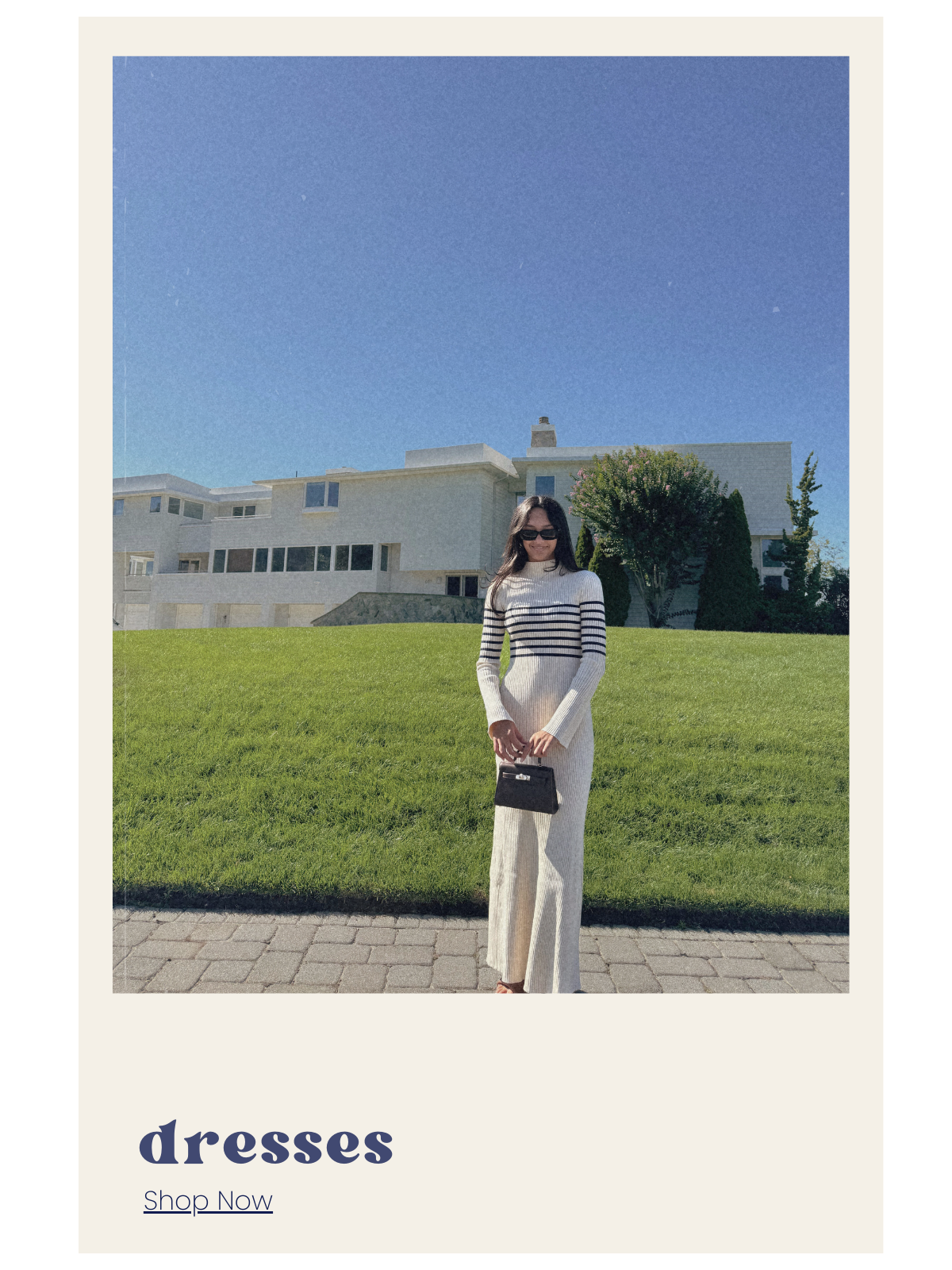 Woman in a striped dress standing on grass with a building in the background, text 'dresses Shop Now' at the bottom.