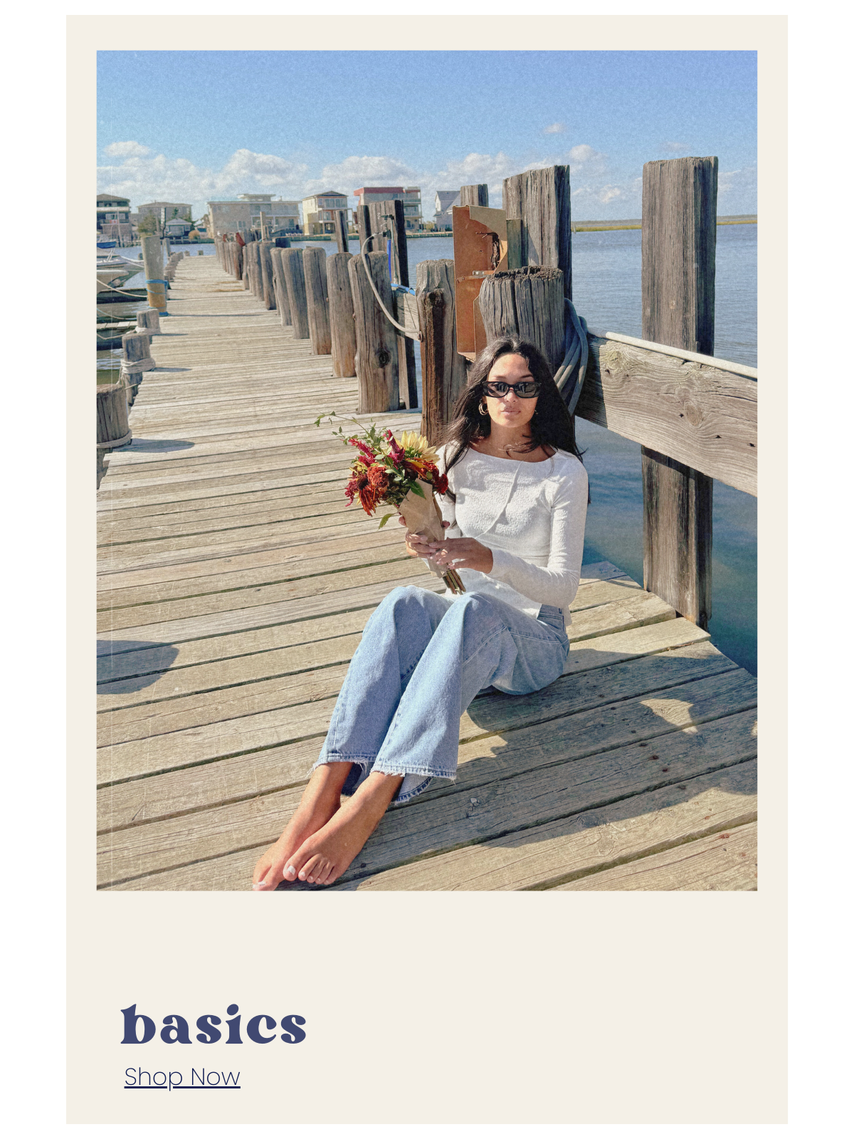 Woman sitting on a wooden dock holding flowers with 'basics' text at the bottom.