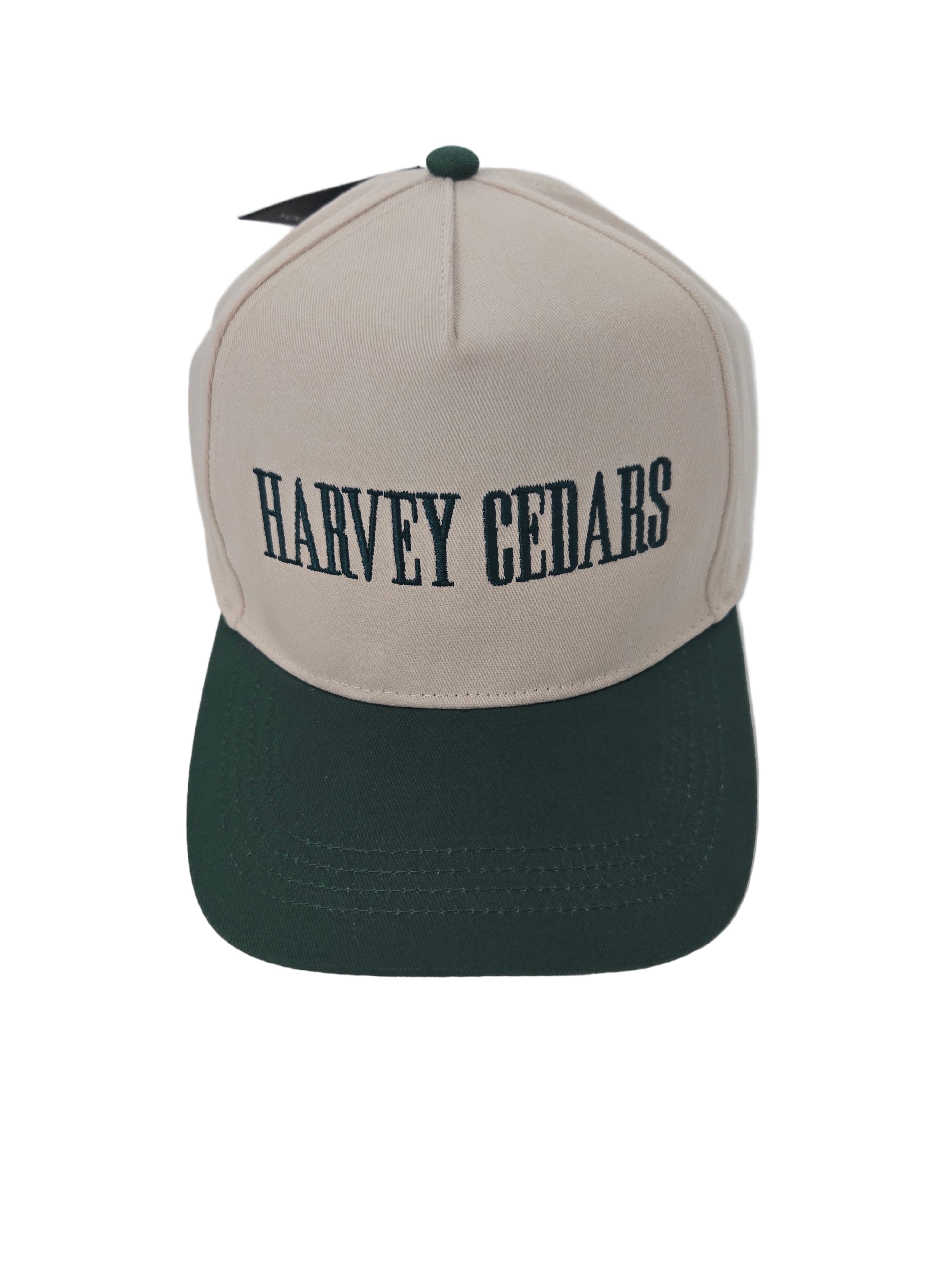 Two-tone cap with 'Harvey Cedars' branding on a light gray background